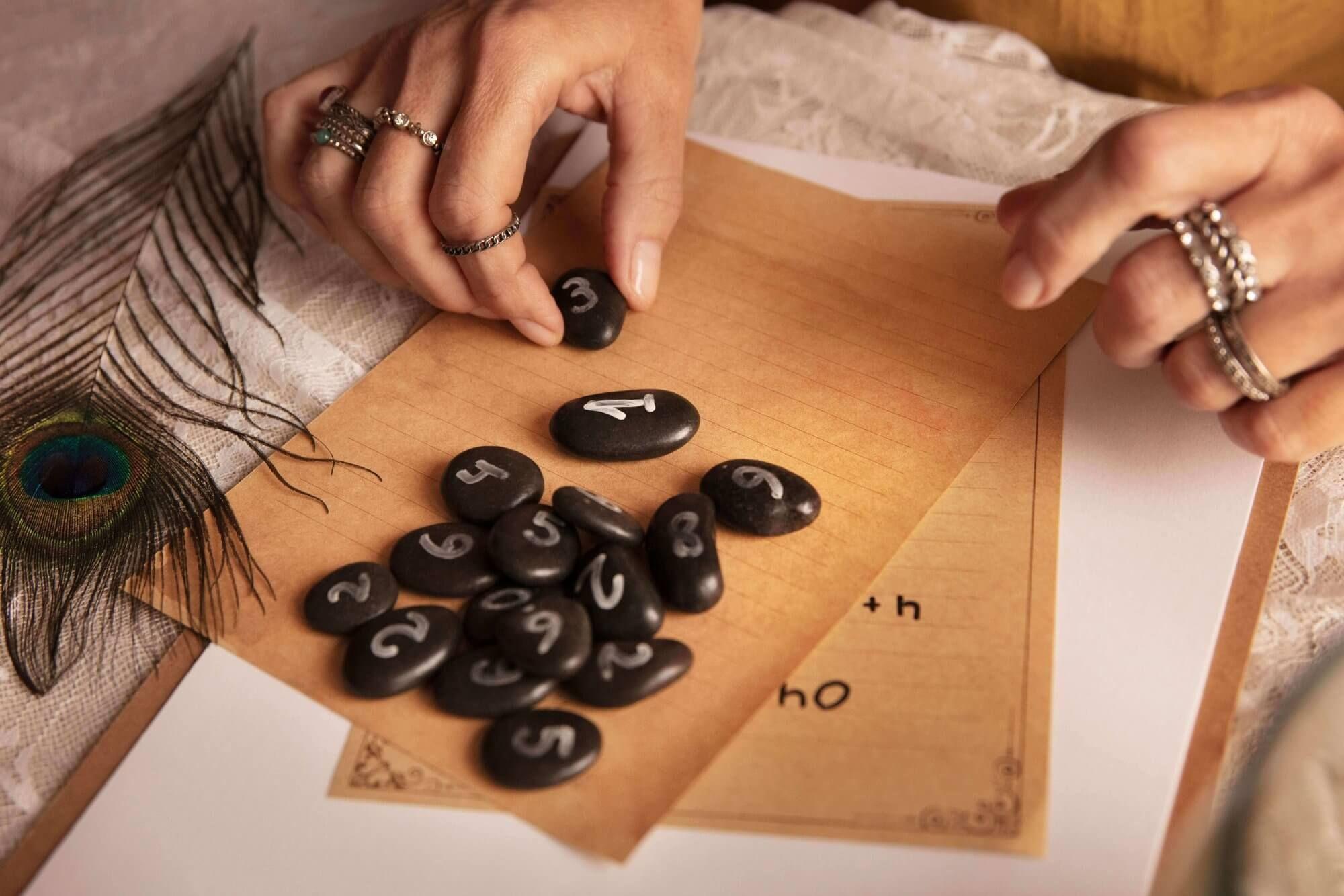 Photo - Small stone runes with carved Nordic symbols