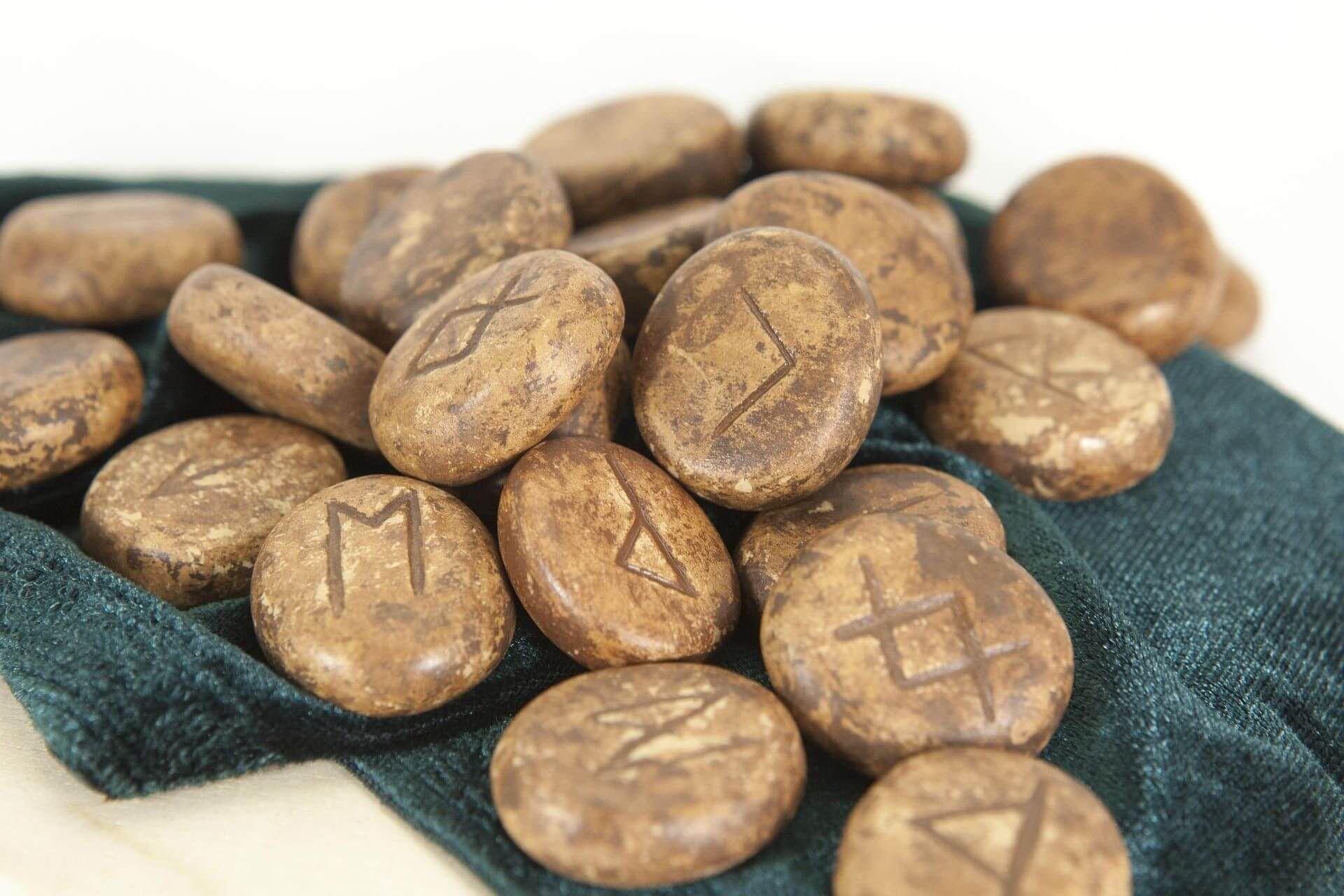A detailed shot of engraved rune stones Photo - A detailed shot of engraved rune stones
