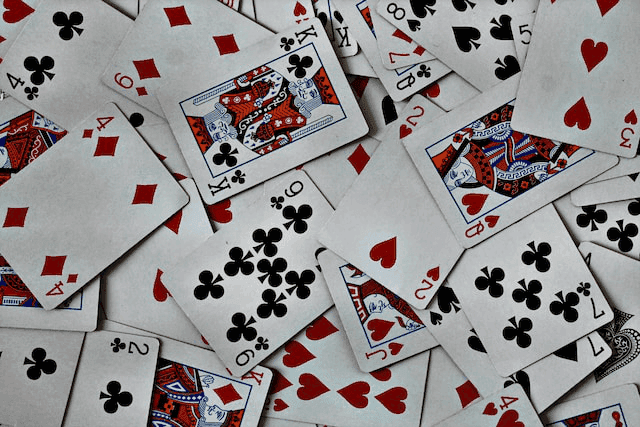 A guide explaining tarot readings with playing cards Photo - A guide explaining tarot readings with playing cards