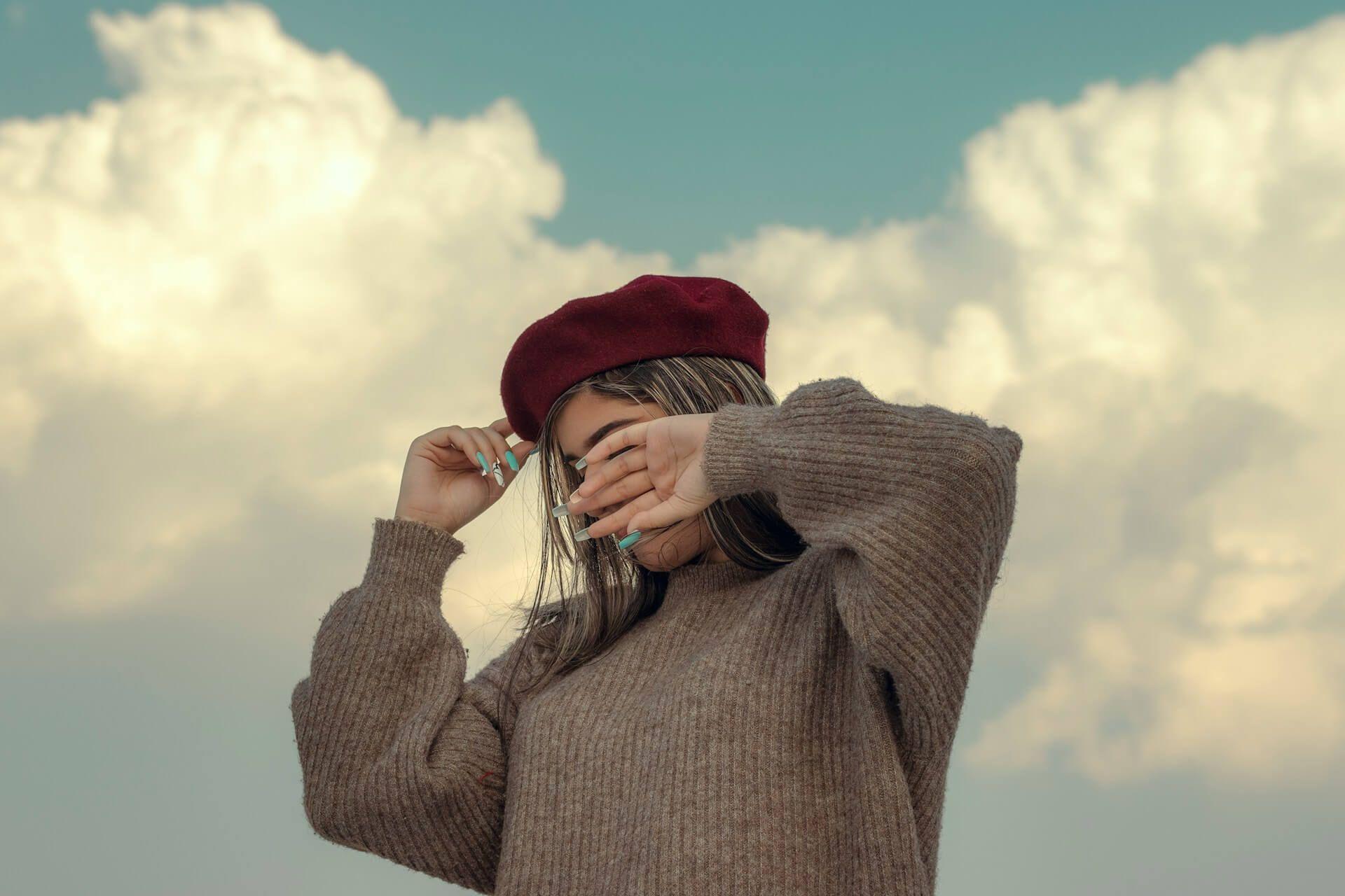 A person sneezing symbolizing spiritual release and energetic clearing Photo - A person sneezing symbolizing spiritual release and energetic clearing