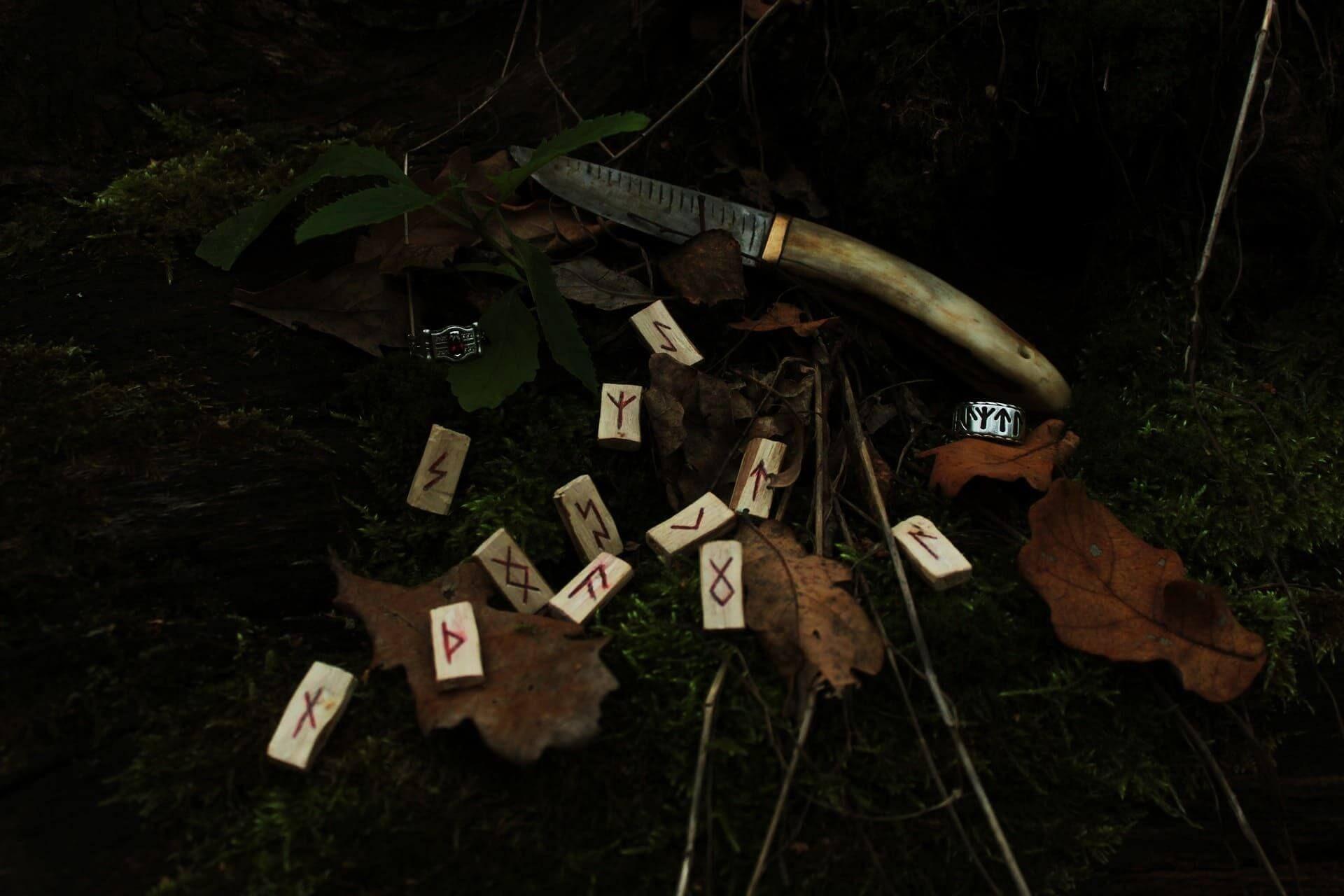 Rune stones with ancient alphabet markings Photo - Rune stones with ancient alphabet markings
