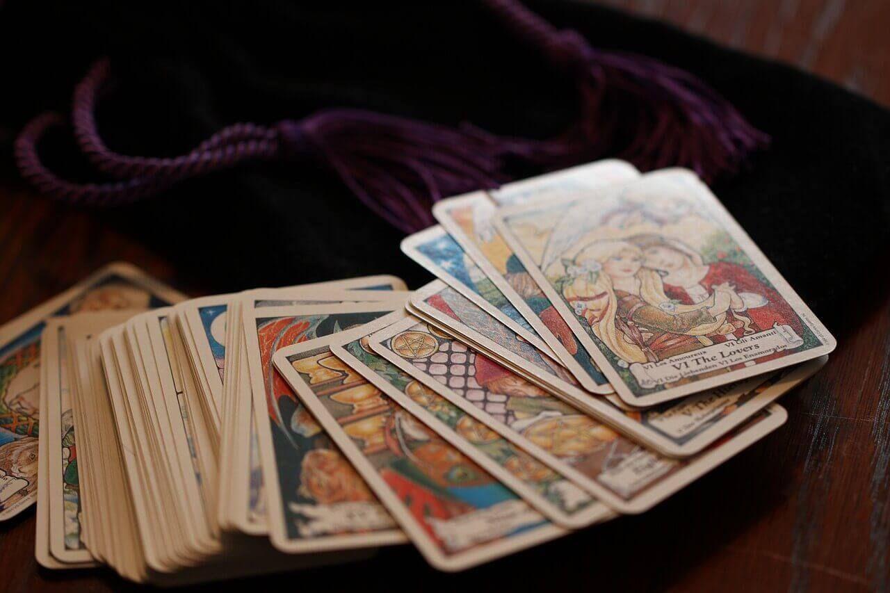 stack of tarot cards on the table Photo - stack of tarot cards on the table